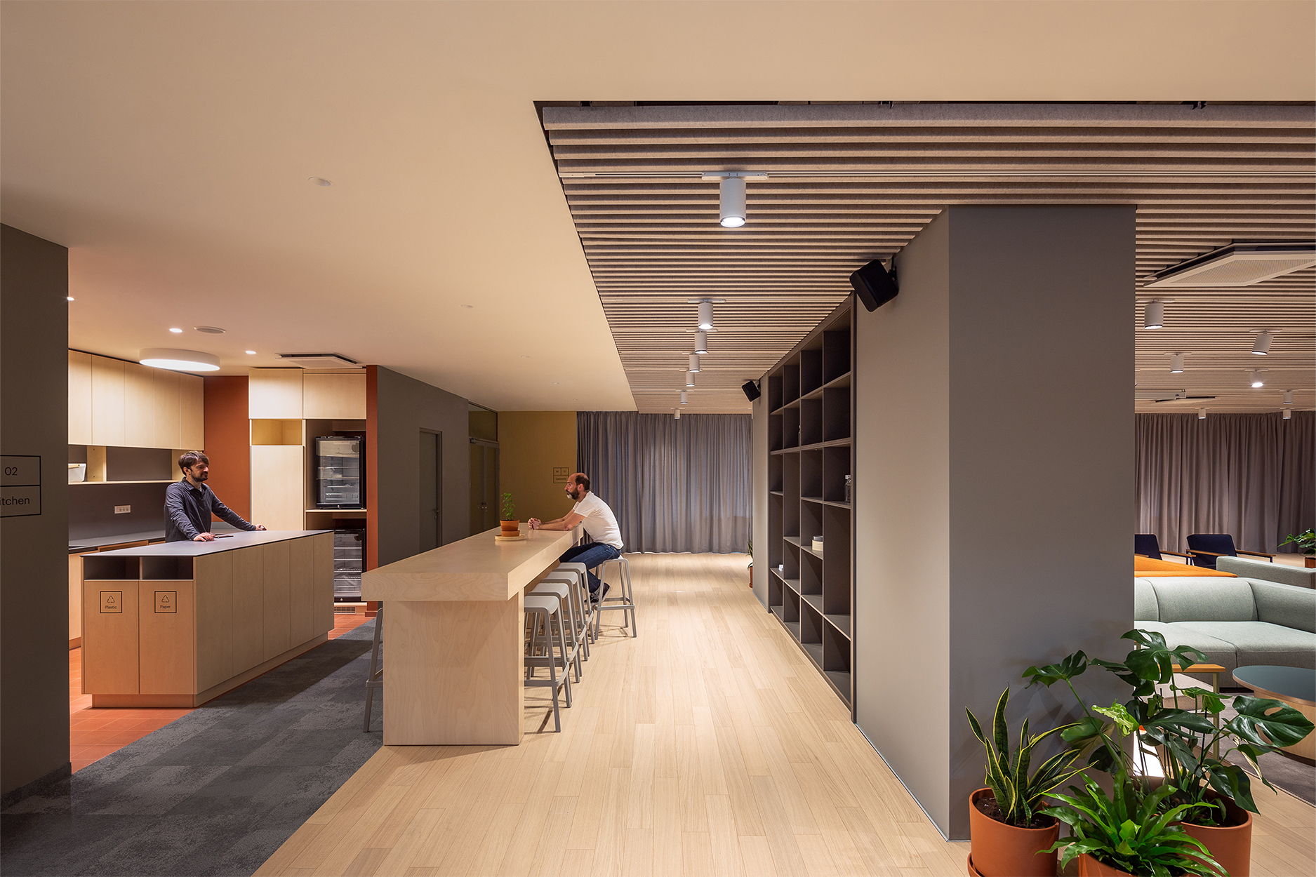 office kitchen with bar counter and seating Zühlke workspace interior