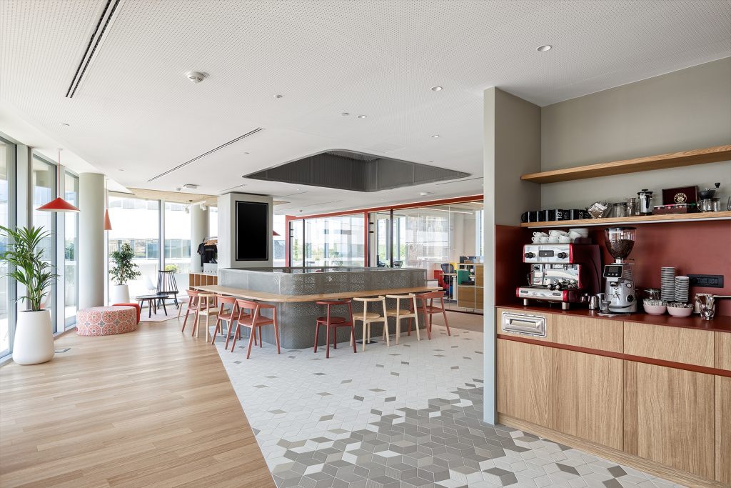 coffee point with warm brick tones in Nordeus workspace interior